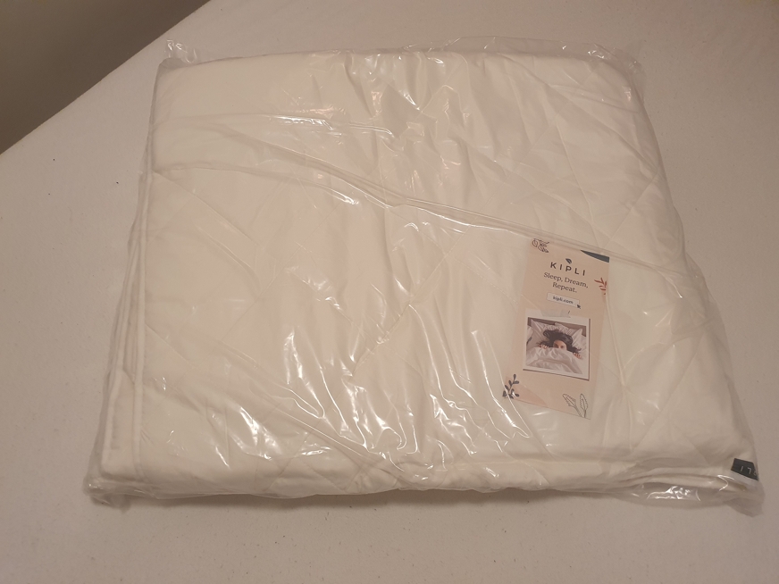 Kipli dekbed in plastic